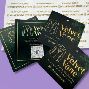 Чорно-золоті брендовані бірки Velvet Vane для одягу.