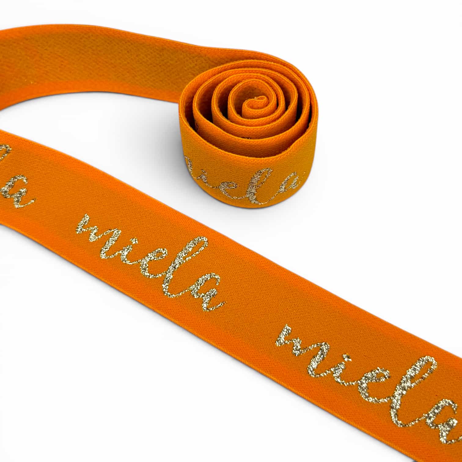 Orange jacquard elastic band with cursive glitter lurex text