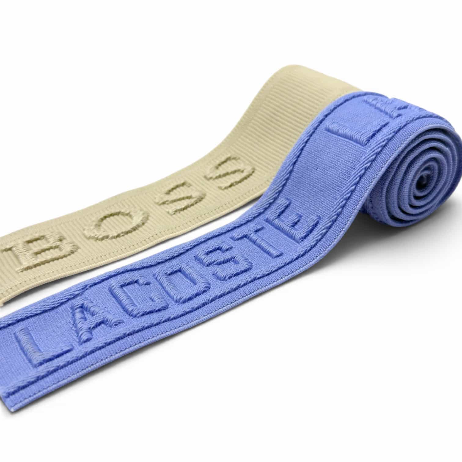 Ribbed jacquard elastic band with textured embossed brand lettering