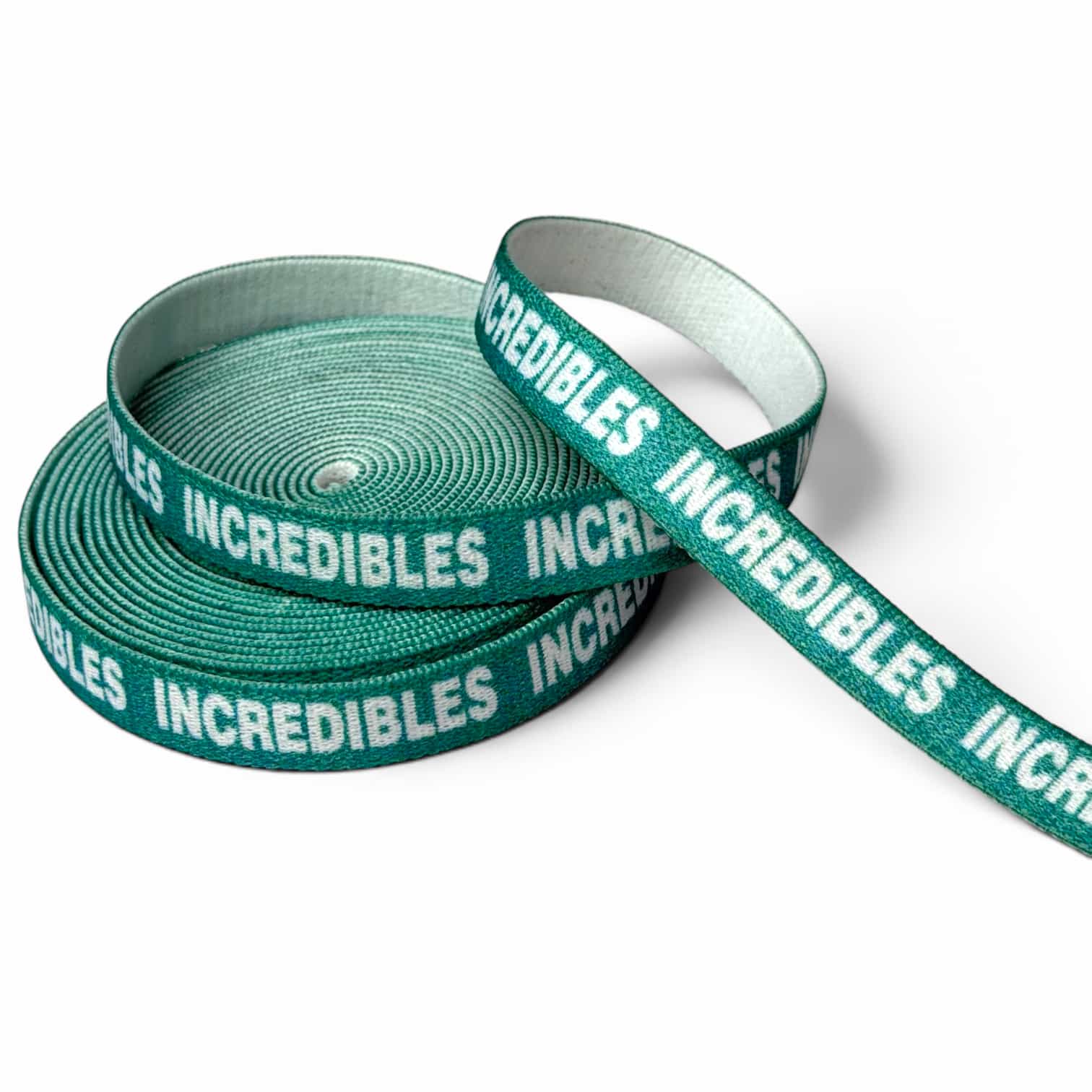 Narrow green jacquard elastic band with custom white text