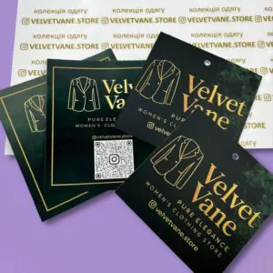 Чорно-золоті брендовані бірки Velvet Vane для одягу.